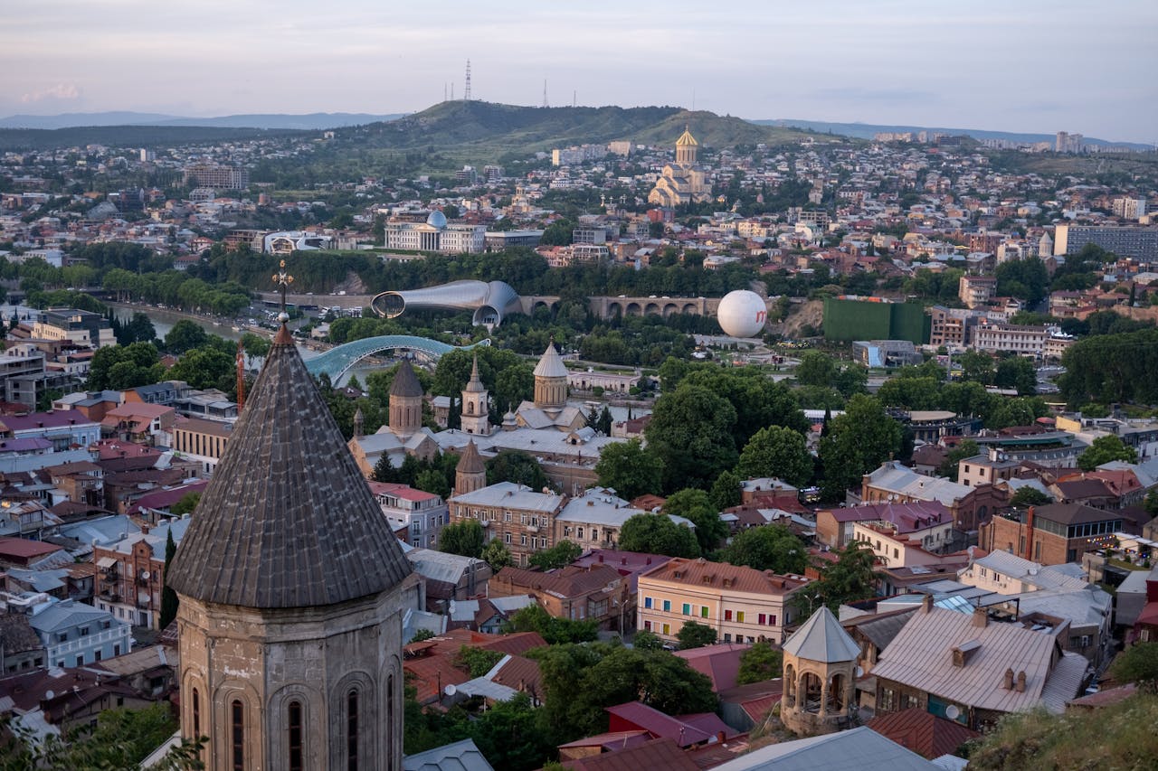 Discover the stunning cityscape of Tbilisi, Georgia, highlighting its architectural diversity and vibrant urban charm.