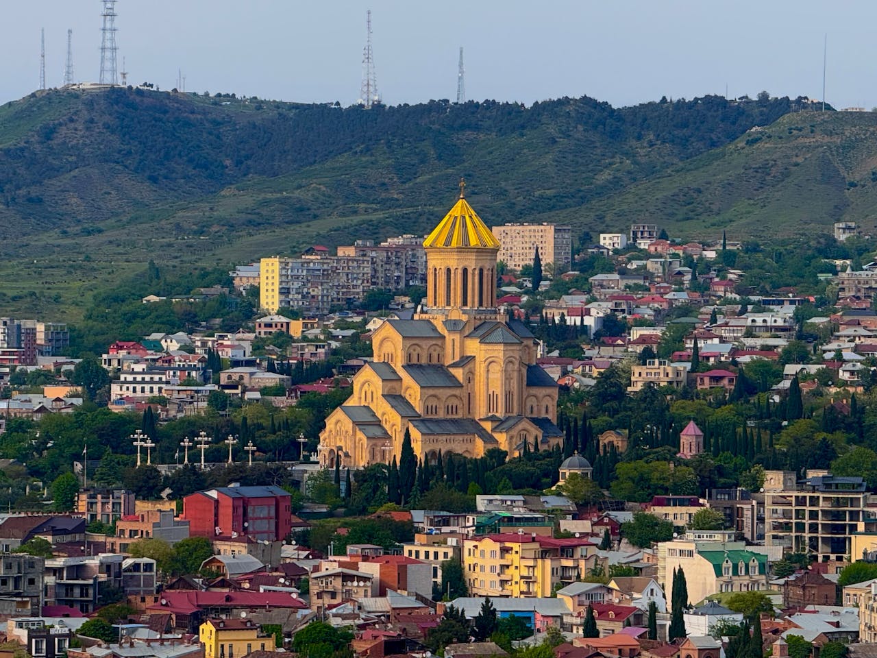 Stunning aerial view of the Holy Trinity Cathedral with Tbilisi cityscape in the background, Georgia.